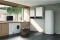 The image shows the Viessmann Vitocal 250-AH hybrid heat pump in a modern utility room